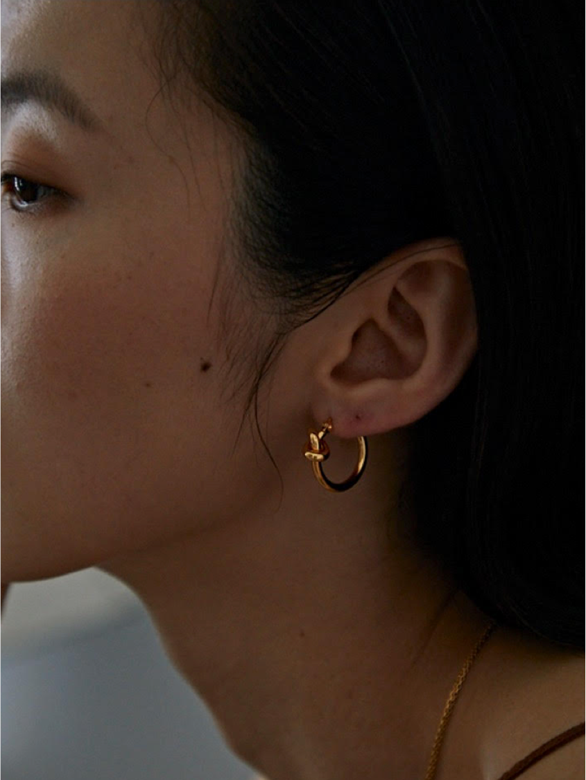 Gold knot hoop earrings on sale